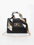 Sac à main élégant en cuir brun avec détail foulard